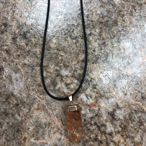 Orange Crackle Quartz On 20 Inch Black Rubber Necklace