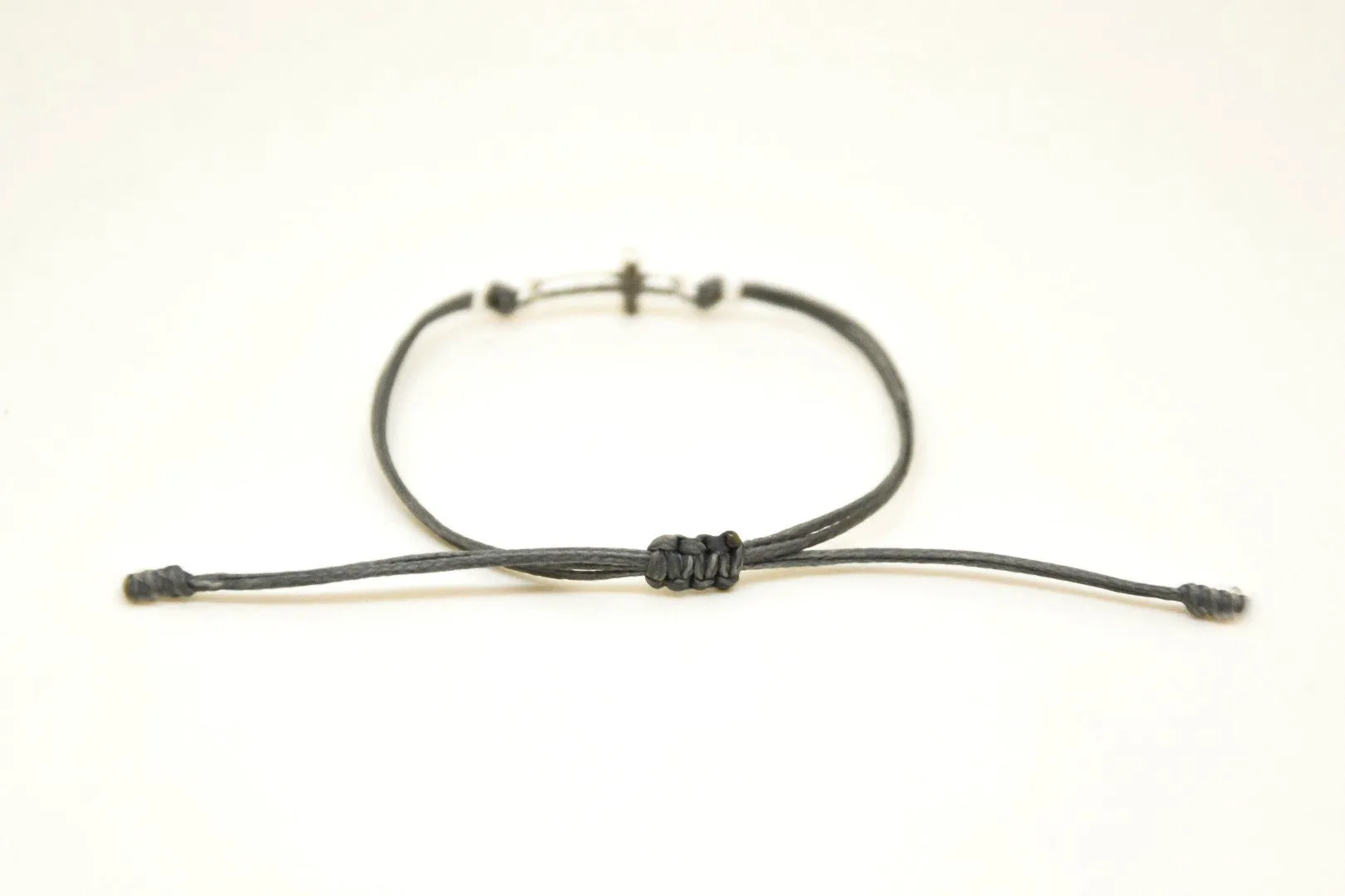 Women bracelet with silver cross charm, Gray cord, adjustable